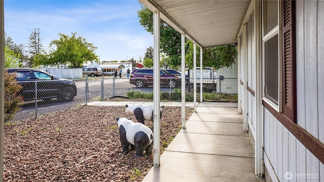 view of patio with fence and covered porch