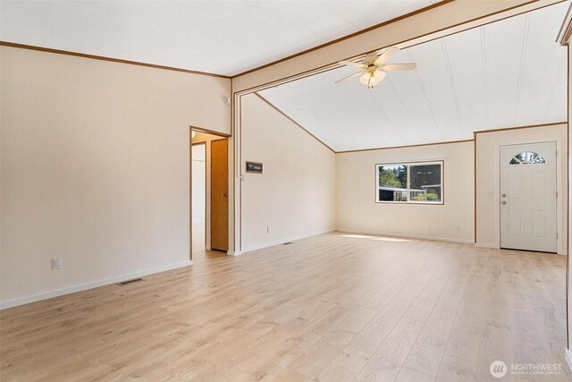 unfurnished living room featuring ornamental molding, lofted ceiling, a ceiling fan, baseboards, and light wood finished floors