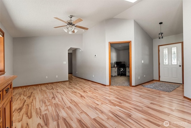 12430 Brooks St SW, Olympia, WA 98512 - entryway featuring baseboards, light wood finished floors, ceiling fan, and lofted ceiling