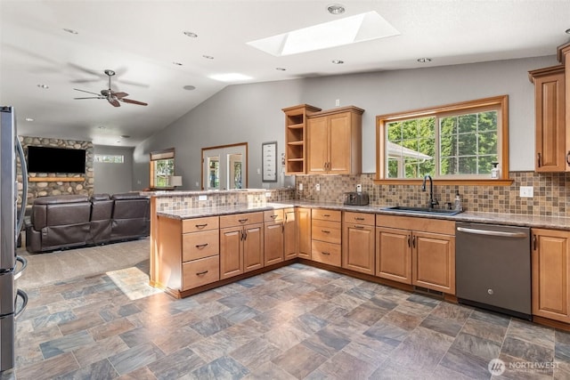 12430 Brooks St SW, Olympia, WA 98512 - kitchen with stainless steel dishwasher, open shelves, a peninsula, plenty of natural light, and a sink
