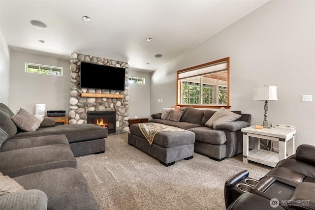 12430 Brooks St SW, Olympia, WA 98512 - living room with carpet flooring, a stone fireplace, and lofted ceiling