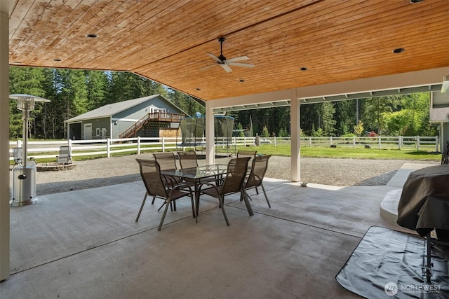 12430 Brooks St SW, Olympia, WA 98512 - view of patio featuring a fenced backyard, outdoor dining area, and ceiling fan