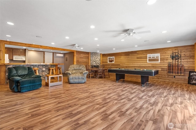 12430 Brooks St SW, Olympia, WA 98512 - playroom featuring wooden walls, a ceiling fan, and wood finished floors