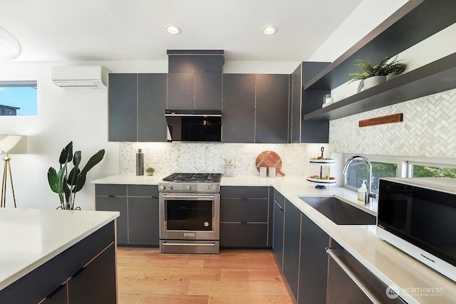 3236 W Government Way, Seattle, WA 98199 - kitchen featuring open shelves, a sink, stainless steel gas stove, light countertops, and a wall unit AC