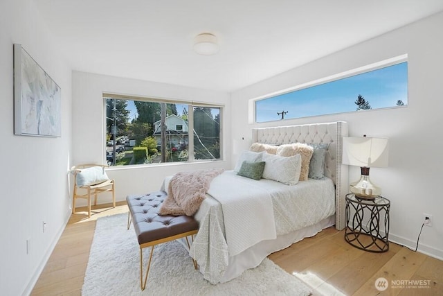 3236 W Government Way, Seattle, WA 98199 - bedroom with baseboards and wood finished floors
