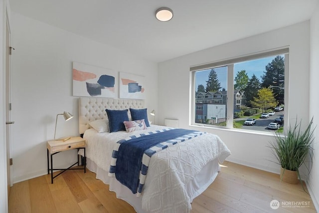 3236 W Government Way, Seattle, WA 98199 - bedroom with baseboards and wood finished floors