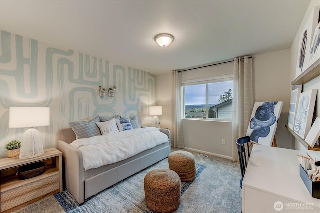 carpeted bedroom featuring baseboards