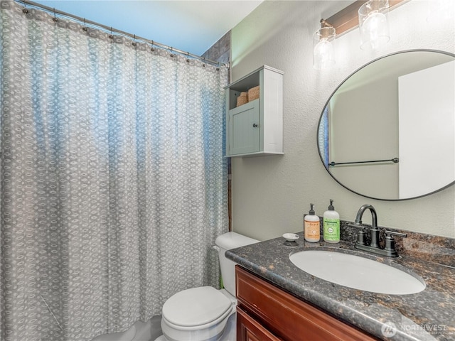 bathroom with vanity, a shower with curtain, and toilet