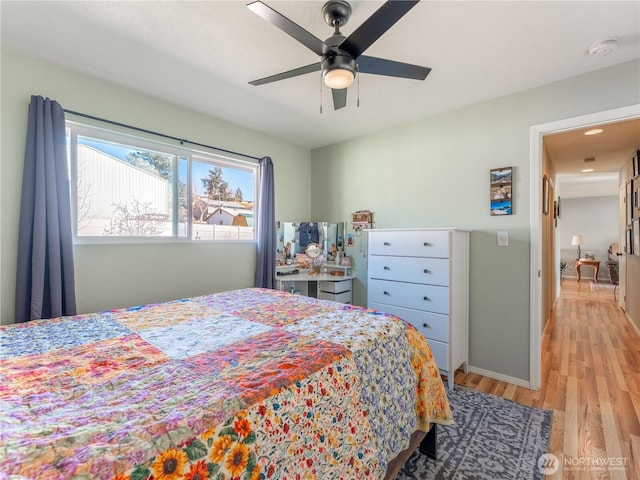 bedroom featuring ceiling fan and light wood finished floors