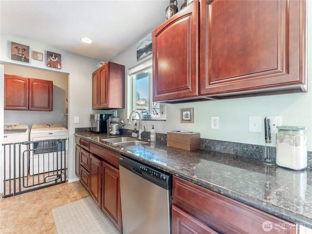 kitchen featuring stainless steel dishwasher, a sink, dark stone counters, recessed lighting, and washer and clothes dryer