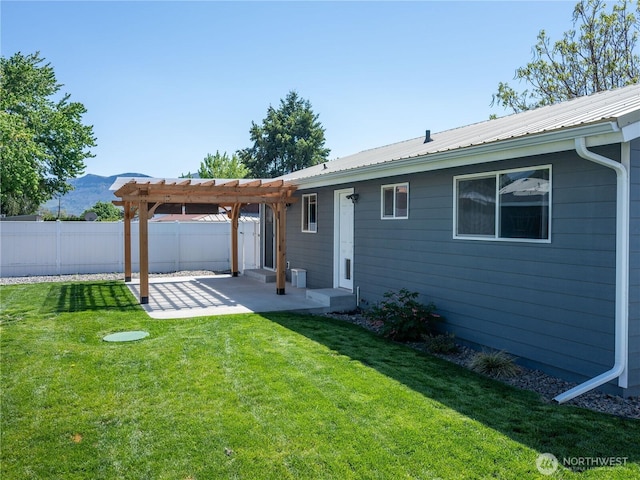 back of property with a lawn, a pergola, fence, and a patio