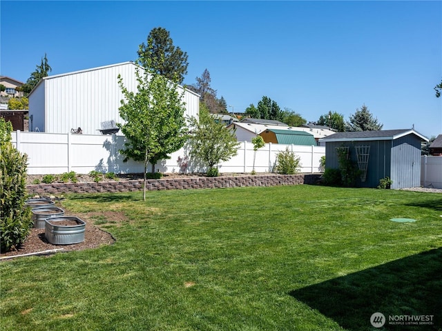 view of yard featuring an outbuilding, a fenced backyard, and a shed