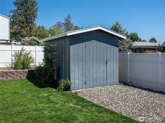 view of shed featuring fence