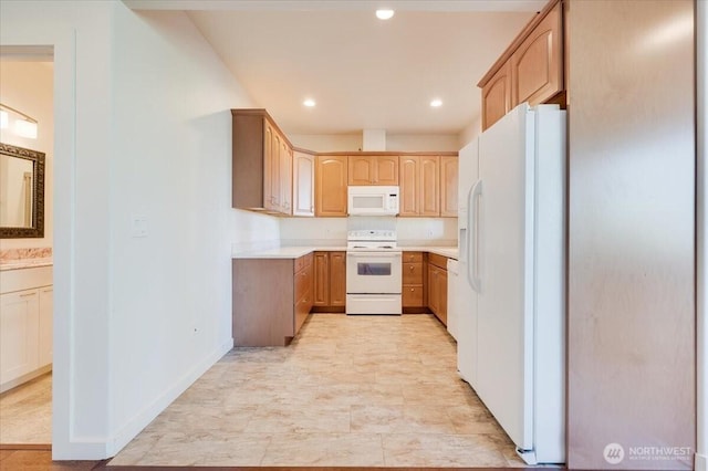 kitchen with light brown cabinetry, white appliances, light countertops, recessed lighting, and baseboards