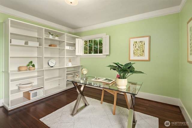 office space with baseboards, ornamental molding, wood finished floors, and visible vents
