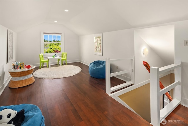 bonus room with baseboards, recessed lighting, lofted ceiling, and wood finished floors
