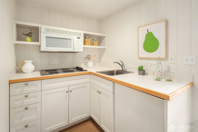 kitchen with open shelves, a sink, light countertops, stainless steel electric cooktop, and white microwave