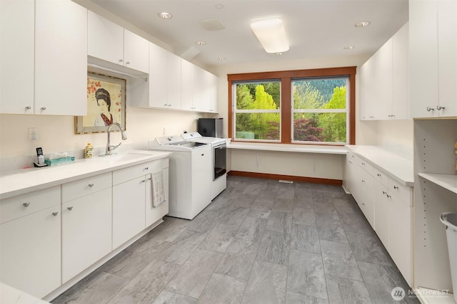 15803 Uplands Way SE, North Bend, WA 98045 - laundry area with cabinet space and washing machine and clothes dryer