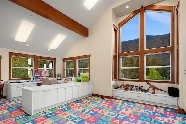15803 Uplands Way SE, North Bend, WA 98045 - kitchen with beamed ceiling, a mountain view, white cabinetry, light countertops, and recessed lighting