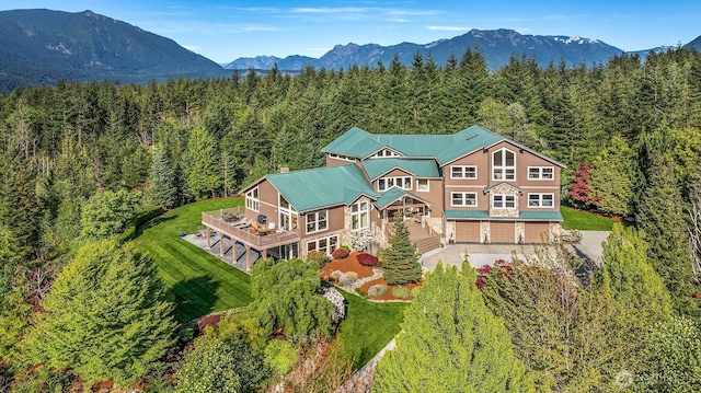 15803 Uplands Way SE, North Bend, WA 98045 - aerial view of property and surrounding area featuring a heavily wooded area and a mountain backdrop