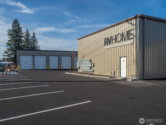 view of building exterior featuring uncovered parking