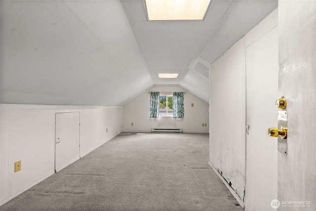 bonus room featuring a baseboard radiator, carpet flooring, and lofted ceiling
