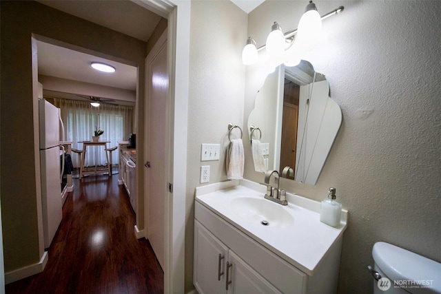 34012 1st Pl S # J, Federal Way, WA 98003 - half bath with vanity, toilet, and wood finished floors