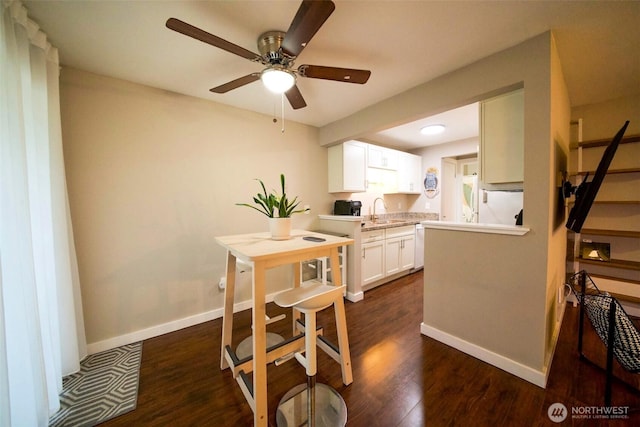 34012 1st Pl S # J, Federal Way, WA 98003 - dining space featuring dark wood-type flooring, baseboards, and ceiling fan
