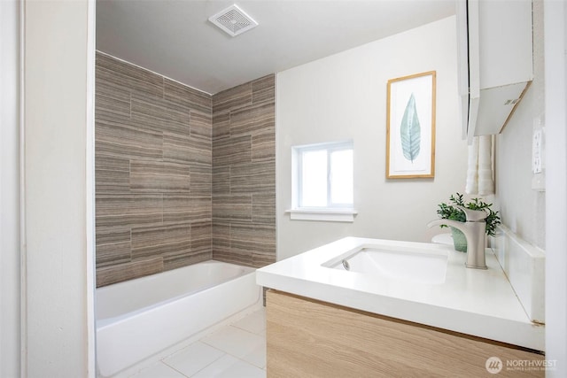 full bath with tile patterned floors, visible vents, and vanity