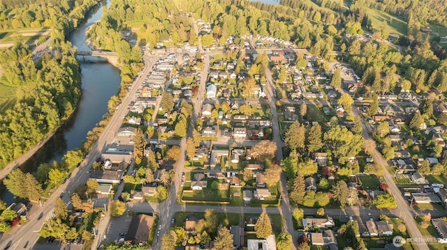 bird's eye view featuring a water view and a residential view