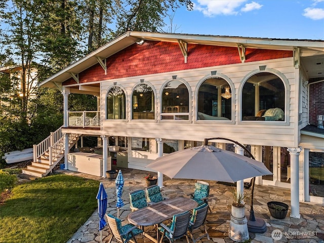 exterior space with stairway and a patio