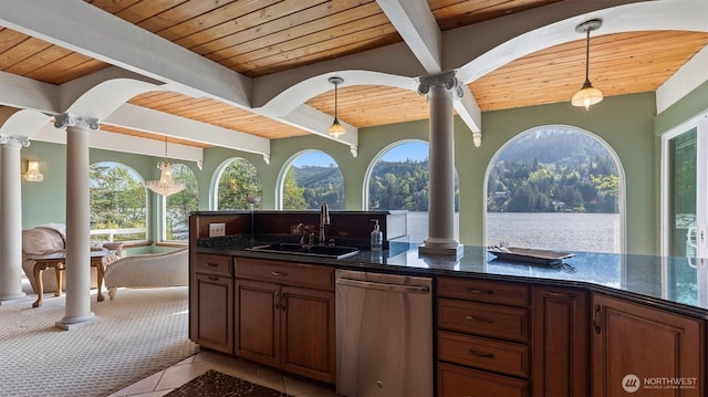 kitchen featuring a sink, wooden ceiling, ornate columns, and dishwasher