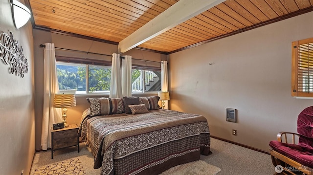 bedroom featuring crown molding, baseboards, wood ceiling, and carpet