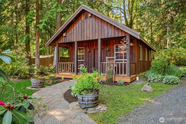 view of outbuilding featuring covered porch
