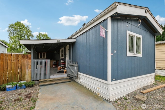 view of home's exterior featuring fence