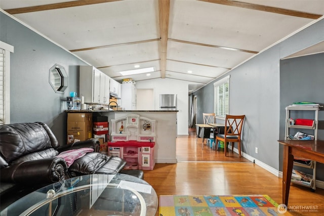 living area with light wood-style floors, recessed lighting, baseboards, and vaulted ceiling with beams
