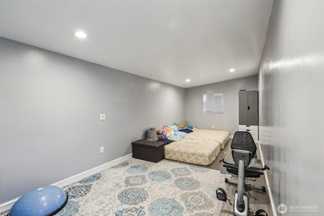 bedroom with recessed lighting and baseboards