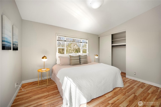 bedroom featuring baseboards, a closet, and wood finished floors