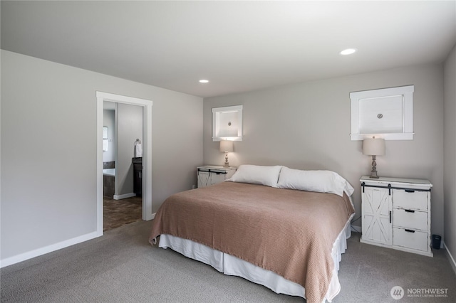 carpeted bedroom with baseboards, recessed lighting, and connected bathroom