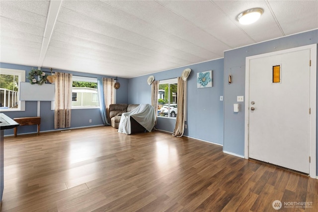 15713 81st St E Unit 135, Puyallup, WA 98372 - foyer featuring healthy amount of natural light, wood finished floors, and baseboards