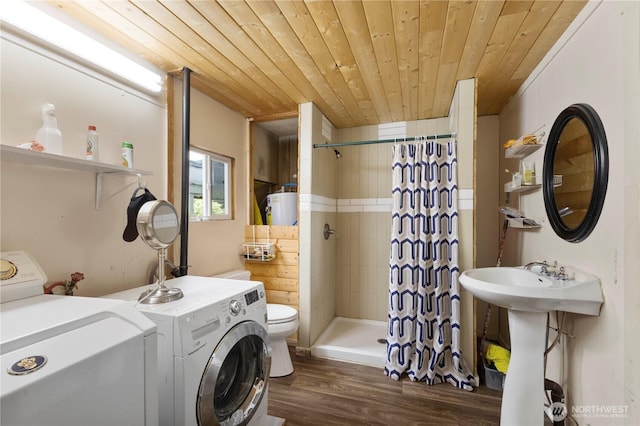 15713 81st St E Unit 135, Puyallup, WA 98372 - bathroom featuring wooden ceiling, a stall shower, wood finished floors, toilet, and washing machine and clothes dryer
