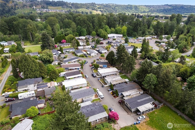 15713 81st St E Unit 135, Puyallup, WA 98372 - aerial view of property and surrounding area with nearby suburban area and a heavily wooded area