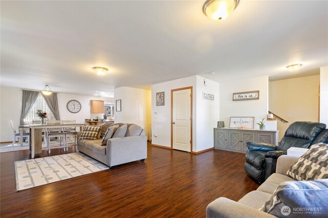 living room with wood finished floors and baseboards