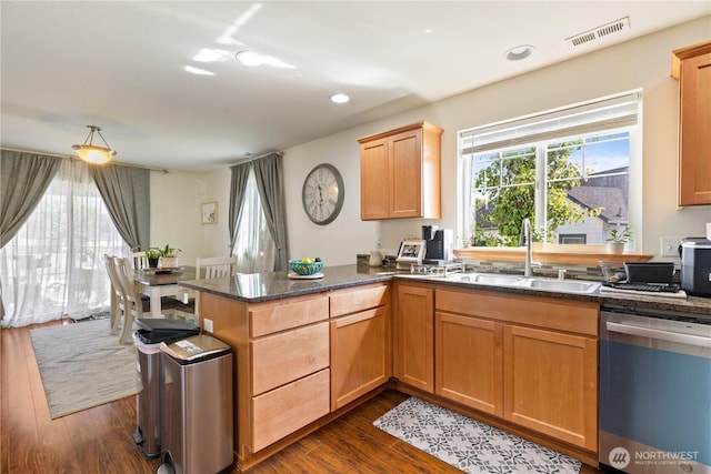 kitchen with dishwashing machine, a sink, dark wood-style flooring, a peninsula, and recessed lighting