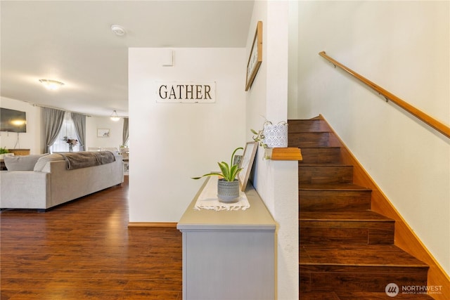 stairs with wood finished floors