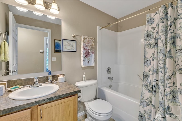 full bathroom with vanity, shower / bathtub combination with curtain, and toilet