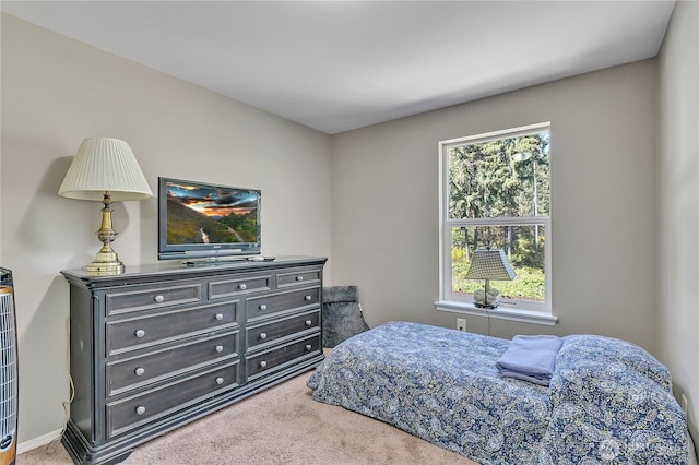 carpeted bedroom with baseboards