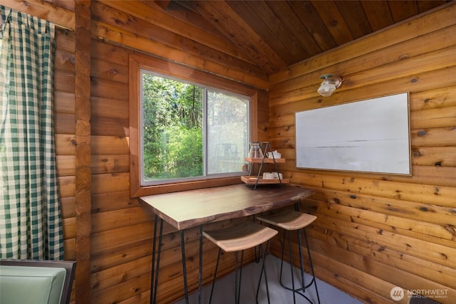 dining space featuring wood ceiling and vaulted ceiling
