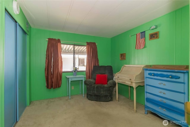 living area featuring carpet flooring