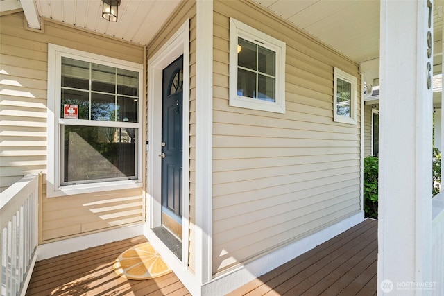 view of exterior entry featuring a porch